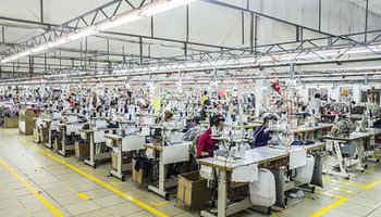 sewing-machine workers in factory