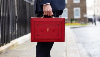 The Chancellor Jeremy Hunt walks outside Downing Street with the Budget box. Photo by Zara Farrar / HM Treasury