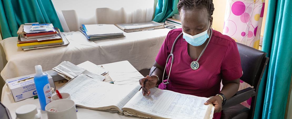 A medical consultant goes through records at Nairobi West Prison Clinic crop