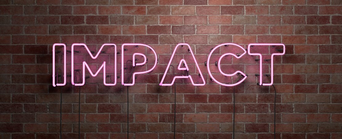 IMPACT - fluorescent Neon tube Sign on brickwork