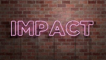 IMPACT - fluorescent Neon tube Sign on brickwork
