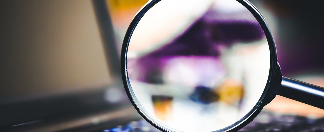 Magnifying glass on computer keyboard