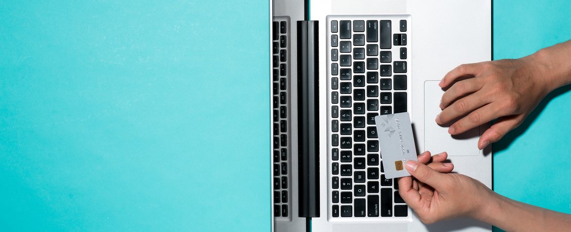 Top view of male hands making online payment