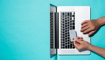 Top view of male hands making online payment