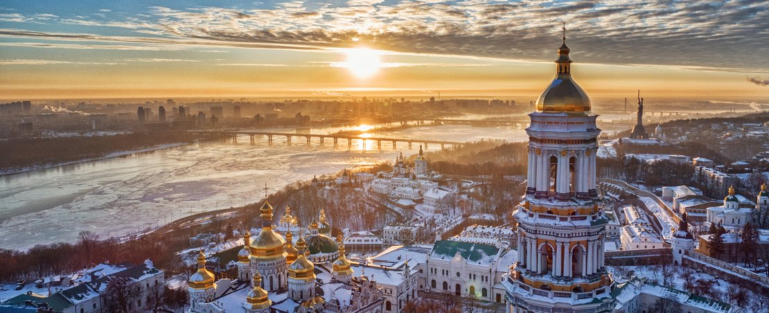Orange sunset and cloud over cityscape Kiev, Ukraine, Europe