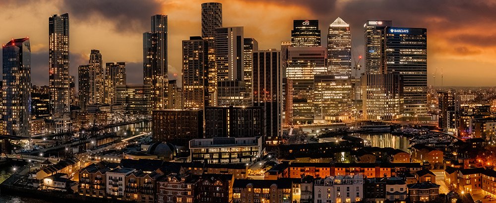Canary Wharf and London city skyline at dusk. Copyright Adobe Stock