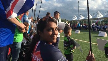 Tania Nadarajah in Paralympic kit holding Union Jack flag