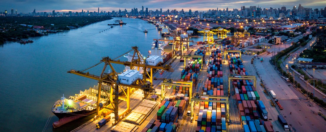 Aerial view of international port with Crane loading containers