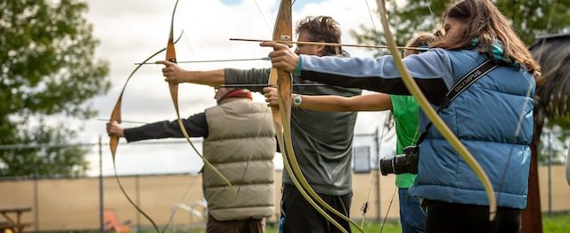 Group doing archery