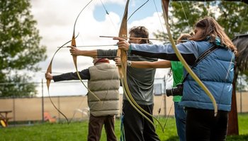 Group doing archery