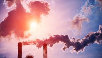 Smoking chimneys of a coal fired power plant