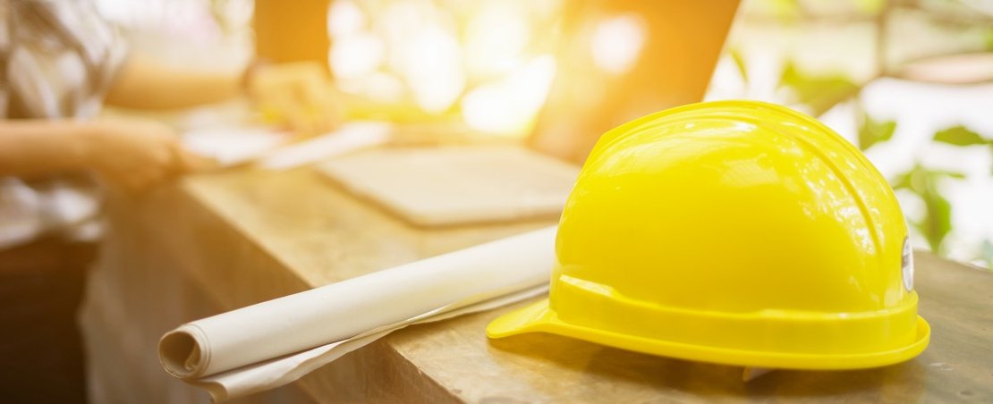 yellow hard hat on bench