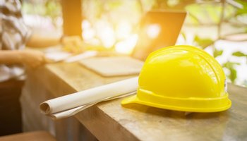 yellow hard hat on bench