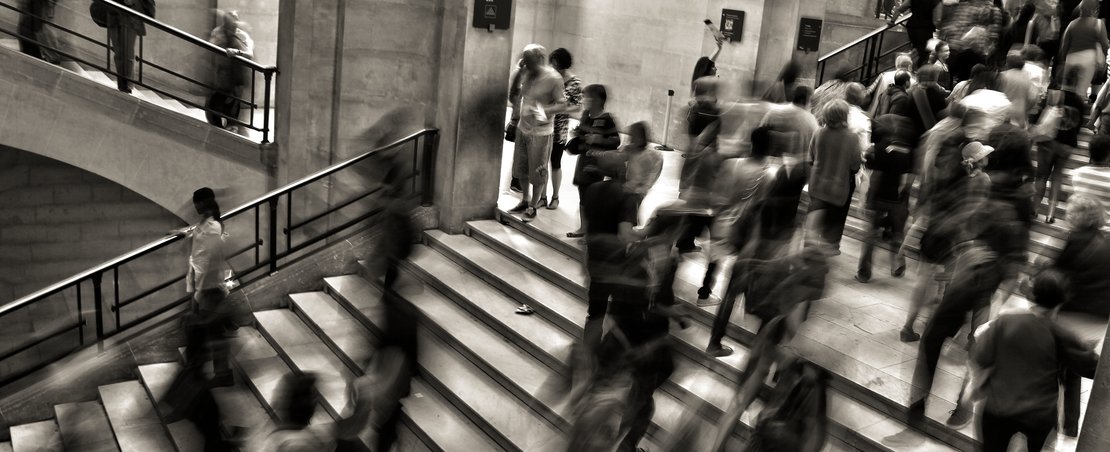 People walking up stairs, blurred, black & white photo