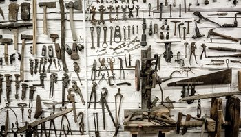 Tools hanging on toolshed wall