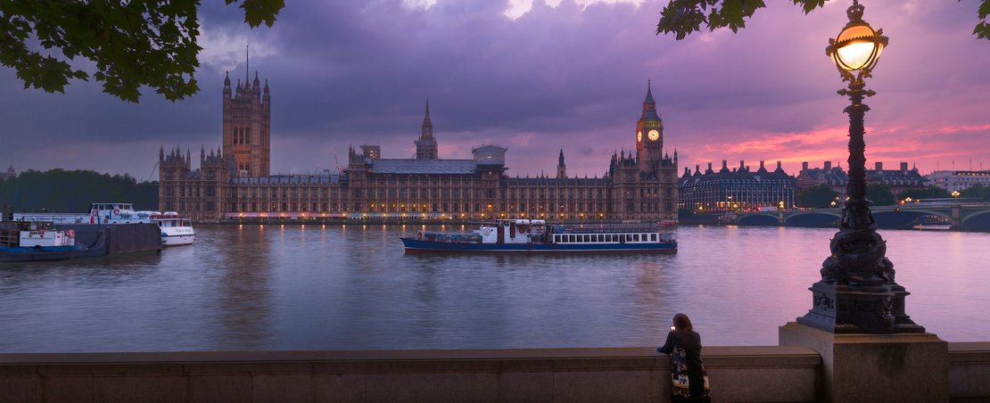 Looking across the River Thames to Westminster at dusk